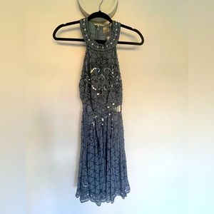 Beautiful sequined, cut out dress in a blue gray.